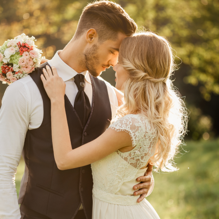 Two young people kissing at a wedding